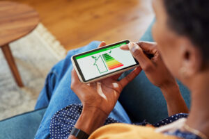 woman checking phone for Energy-Efficient Plumbing